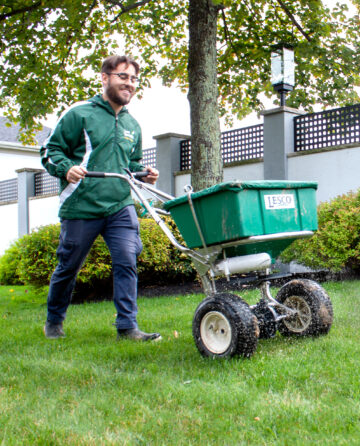 Man seeding lawn